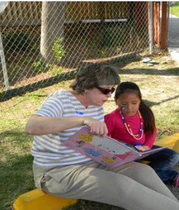 Caroline reading to girl